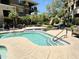 Relaxing community pool with crystal clear water and beautiful landscaping near the building at 7601 E Indian Bend Rd # 1049, Scottsdale, AZ 85250