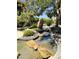 Unique water feature with artful rock placement and lush plantings. Serene and calming at 7601 E Indian Bend Rd # 1049, Scottsdale, AZ 85250