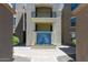 Modern building exterior showcasing a striking blue tile water feature at 7601 E Indian Bend Rd # 1049, Scottsdale, AZ 85250