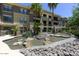 Elegant water feature surrounded by lush greenery in a well-maintained complex at 7601 E Indian Bend Rd # 1049, Scottsdale, AZ 85250