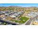 Community aerial view with a playground, neighborhood streets, and houses with mountain views at 8138 E Jacaranda St, Mesa, AZ 85207