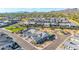 Neighborhood aerial view featuring desert landscaping, parks, and mountains in the distance at 8138 E Jacaranda St, Mesa, AZ 85207