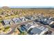 Neighborhood aerial view with desert landscape showcasing houses with tile roofs at 8138 E Jacaranda St, Mesa, AZ 85207