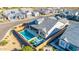 Backyard aerial view highlighting pool, artificial turf, patio furniture, and built-in barbecue at 8138 E Jacaranda St, Mesa, AZ 85207