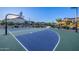 Outdoor community basketball court is surrounded by green space and walking paths at 8138 E Jacaranda St, Mesa, AZ 85207