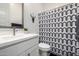Bathroom featuring a geometric shower curtain, vanity with decor, and modern fixtures at 8138 E Jacaranda St, Mesa, AZ 85207