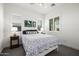Cozy bedroom with plantation shutters, neutral decor, and ample natural light at 8138 E Jacaranda St, Mesa, AZ 85207