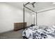 A well-lit bedroom features modern minimalist design and gray carpeted flooring at 8138 E Jacaranda St, Mesa, AZ 85207