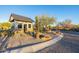 Neighborhood entrance showcasing the guard house, gate and xeriscaping at 8138 E Jacaranda St, Mesa, AZ 85207