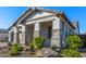 Charming home with well-maintained landscaping, stone accents, and an inviting porch at 8138 E Jacaranda St, Mesa, AZ 85207