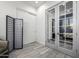 Bright hallway with stylish doors, modern decor, and wood-look tile flooring at 8138 E Jacaranda St, Mesa, AZ 85207