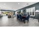 Open-concept living and dining area with stylish decor and sliding glass doors to the outdoor patio at 8138 E Jacaranda St, Mesa, AZ 85207