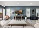 Inviting living room with a modern fireplace, decorative accents, and large windows for natural light at 8138 E Jacaranda St, Mesa, AZ 85207