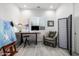 Well-lit home office with a modern desk, comfortable seating, and ample natural light at 8138 E Jacaranda St, Mesa, AZ 85207