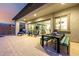 Spacious covered patio with dining area and comfortable seating, seamlessly blending indoor and outdoor living at 8138 E Jacaranda St, Mesa, AZ 85207