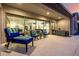 Covered patio with outdoor seating, dining area, and view of the kitchen through sliding glass doors at 8138 E Jacaranda St, Mesa, AZ 85207