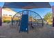 Community playground equipment features shade covering and climbing apparatus at 8138 E Jacaranda St, Mesa, AZ 85207