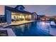Stunning backyard oasis with a sparkling pool, covered patio, and fire pit area for ultimate relaxation at 8138 E Jacaranda St, Mesa, AZ 85207