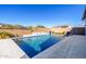 Backyard pool featuring fountain features, desert landscaping and a privacy wall at 8138 E Jacaranda St, Mesa, AZ 85207