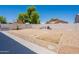 A spacious backyard featuring gravel landscaping, perfect for entertaining and enjoying the outdoors at 9352 W Pioneer St, Tolleson, AZ 85353