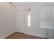 Bright entryway featuring a white front door and tile flooring at 9352 W Pioneer St, Tolleson, AZ 85353
