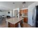 Open concept kitchen and dining area with an island at 9352 W Pioneer St, Tolleson, AZ 85353
