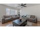 A living room features reclining sofas and a coffee table at 9352 W Pioneer St, Tolleson, AZ 85353