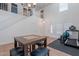 A living room features soaring ceilings, a staircase, and exercise equipment at 9352 W Pioneer St, Tolleson, AZ 85353