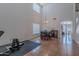 A spacious room with tall ceilings and large windows features exercise equipment at 9352 W Pioneer St, Tolleson, AZ 85353