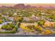 This is an aerial view of a home surrounded by desert landscaping at 9415 N 124Th St, Scottsdale, AZ 85259