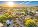 Stunning aerial view of the property displaying a pool and desert landscape at 9415 N 124Th St, Scottsdale, AZ 85259
