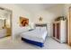 Cozy bedroom with soft carpet, a unique headboard, and a serene atmosphere, perfect for rest and relaxation at 9415 N 124Th St, Scottsdale, AZ 85259