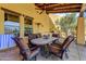 Charming covered patio with comfortable seating, a built-in BBQ, a ceiling fan, and tiled roof at 9415 N 124Th St, Scottsdale, AZ 85259