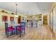 Open dining area with natural light, hardwood floors, and modern furnishings at 9415 N 124Th St, Scottsdale, AZ 85259