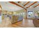 Open living space with hardwood floors, brick accents, and large windows at 9415 N 124Th St, Scottsdale, AZ 85259