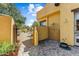 Outdoor shower with a tiled backsplash, lush landscaping, and convenient access to the pool area at 9415 N 124Th St, Scottsdale, AZ 85259
