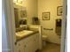 Well-lit bathroom with a single sink, tan walls, and tile flooring for a clean and functional space at 9679 W Cinnabar Ave # B, Peoria, AZ 85345