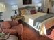 Inviting bedroom showcases a plush bed, a comfortable chair, and carpet for a cozy retreat at 9679 W Cinnabar Ave # B, Peoria, AZ 85345