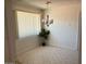 Cozy dining area with a chandelier fixture and natural light from the window at 9679 W Cinnabar Ave # B, Peoria, AZ 85345