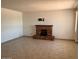 Open living room featuring a brick fireplace and neutral tile flooring at 9679 W Cinnabar Ave # B, Peoria, AZ 85345