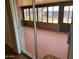 Enclosed patio with brick accents and large windows, offering views of the outdoors at 9679 W Cinnabar Ave # B, Peoria, AZ 85345