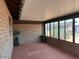 Covered patio featuring brick walls, multiple windows, and plants, perfect for relaxation at 9679 W Cinnabar Ave # B, Peoria, AZ 85345