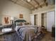 Comfortable bedroom with neutral tones, open closets, and a cozy rug, great natural light at 114 W Adams St # 907, Phoenix, AZ 85003