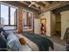Stylish bedroom offers a view into the home's modern kitchen at 114 W Adams St # 907, Phoenix, AZ 85003