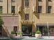 Exterior of building entrance with vintage art deco architecture and beautiful details in tan stone at 114 W Adams St # 907, Phoenix, AZ 85003