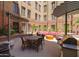 Outdoor courtyard offers ample seating, a grill, and lush landscaping at 114 W Adams St # 907, Phoenix, AZ 85003