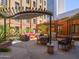 Outdoor courtyard offers ample seating, a grill, and lush landscaping at 114 W Adams St # 907, Phoenix, AZ 85003