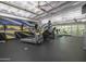 Well-equipped gym featuring modern exercise machines and a vibrant desert-themed mural at 114 W Adams St # 907, Phoenix, AZ 85003