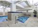 Relaxing hot tub area with tiled accents, comfortable seating, and easy pool access at 114 W Adams St # 907, Phoenix, AZ 85003