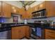 Well-equipped kitchen with stainless steel appliances and black countertops, great storage space at 114 W Adams St # 907, Phoenix, AZ 85003